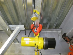 Hoist clamped to beam